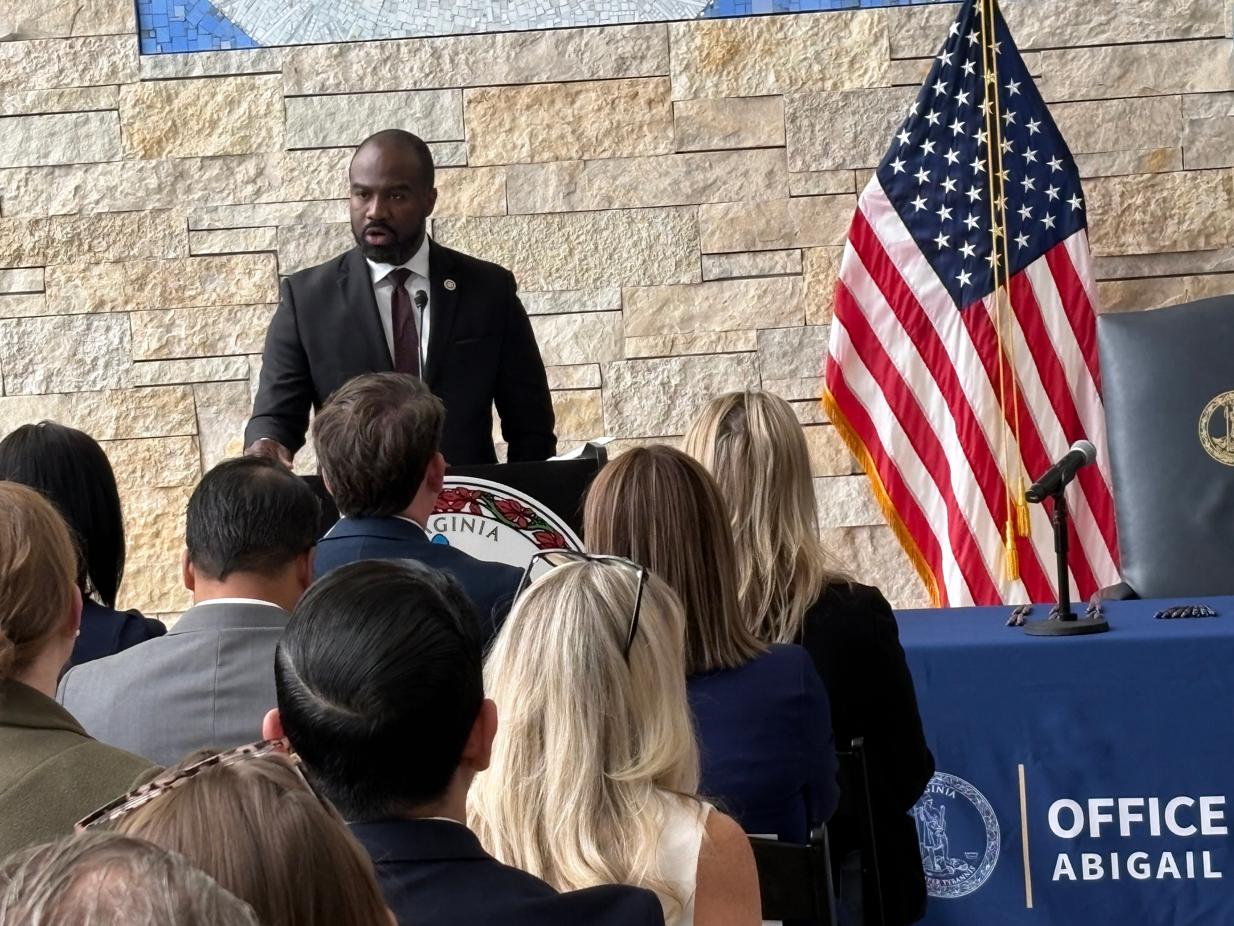 Virginia's Health and Human Services Director Marvin B. Figueroa spoke during Wednesday's bill-signing ceremony in