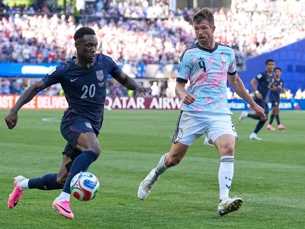 United States' Folarin Balogun (20) and Belgium's Brandon Mechele (4) battle for the ball during the World Cup round of 16 soccer match between the United States and Belgium in Seattle, on Monday.
