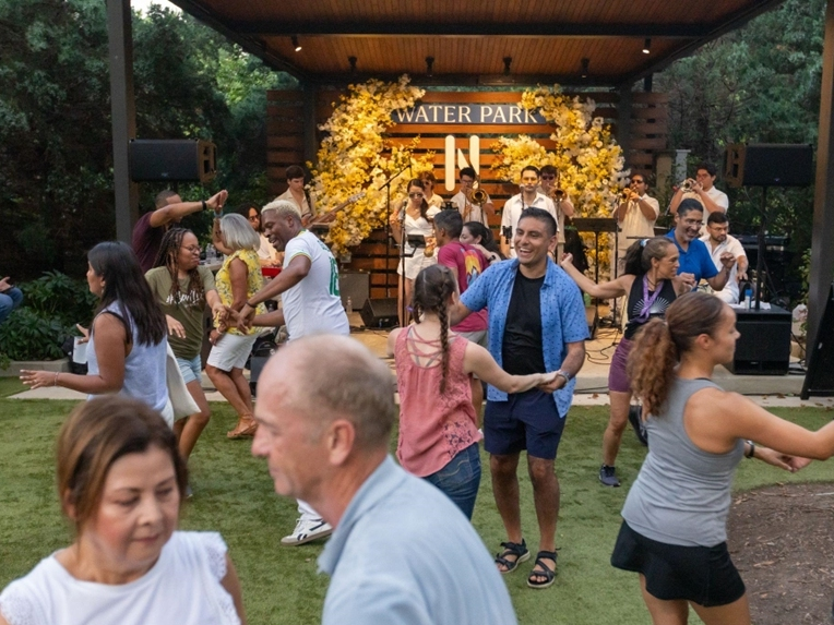 Free live music returns to National Landing's Water Park on July 17 with six weeks of Friday evening concerts in Arlington.
