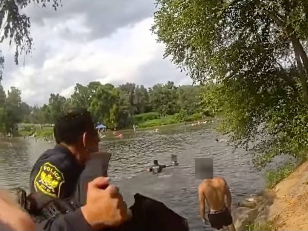 Fredericksburg police officers rescued a drowning swimmer while conducting alcohol enforcement patrols along the riverbank Sunday.