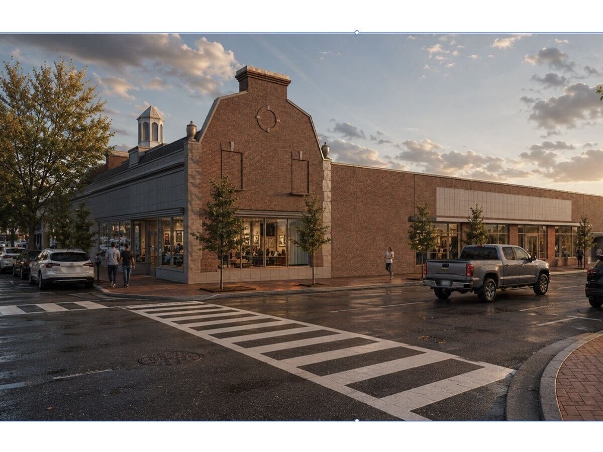 This rendering of the completed project shows the exterior of the two-story commercial building with new storefront windows and doors.