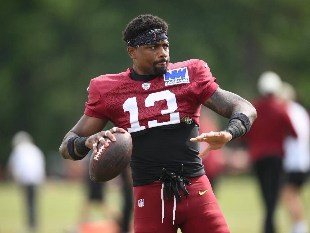 Washington Commanders wide receiver Treylon Burks works out before a joint practice with the Miami Dolphins at NFL football training camp, Wednesday in Ashburn.