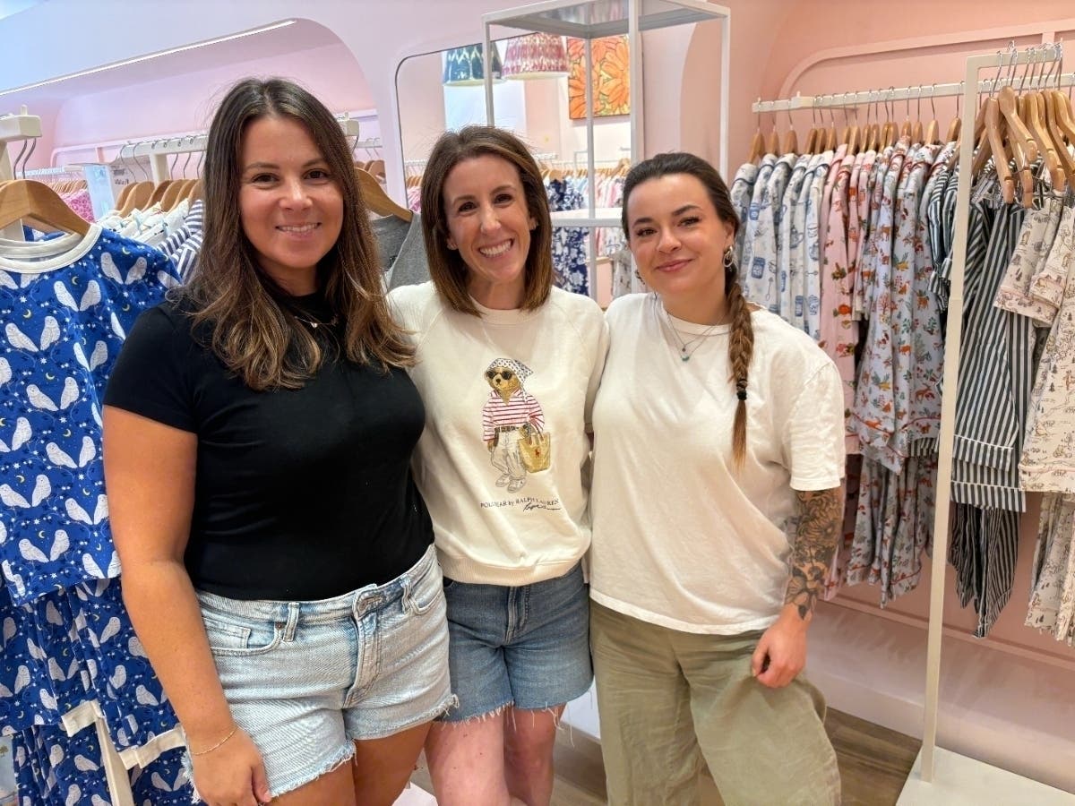From left, BedHead PJ's Director of Marketing Amanda Kogan, Brand Manager Michelle Barresi and intern Brooke Caso stop to have their photo taken before going back to prepare for Saturday's grand opening.