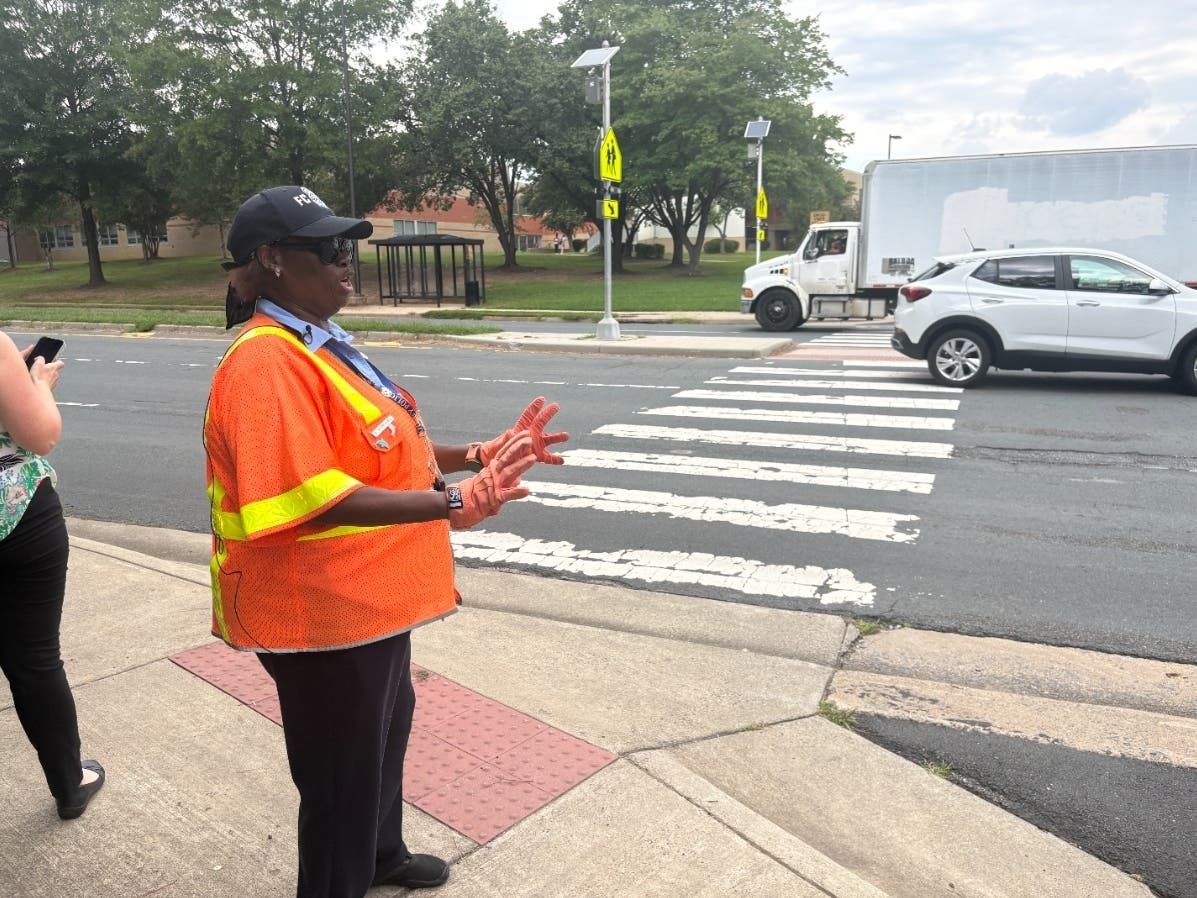 Crossing Guard Anne Rodriguez was back at her familiar post outside South Lakes High School Tuesday afternoon. A student walking to school was struck by a car during Tuesday's rush hour.