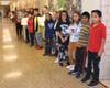 Summit fifth graders anxiously awaited a visit from Yankees Manager Aaron Boone to teach them about science and technology concepts using toy Hess tow trucks.