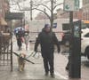 A man walks his dog in the rain last week in Hoboken.
