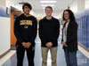 Westfield High School Principal Mary Asfendis congratulates juniors Eric Palia (left) and Sean Hazard for high scores on the SAT and ACT.