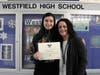 Westfield High School freshman Alexandra Cicala, pictured with principal Mary Asfendis, won two awards for her volunteer work.
