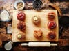 A local couple, an engineer and attorney, founded a craft donut company in Hoboken in 2018 and just opened a small shop in Jersey City Heights on Friday. Ingredients range from banana mousse to fig caramelized bacon.