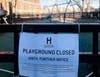 A sign in Elysian Park in Hoboken. Playgrounds were closed on Friday, although parks remain open.