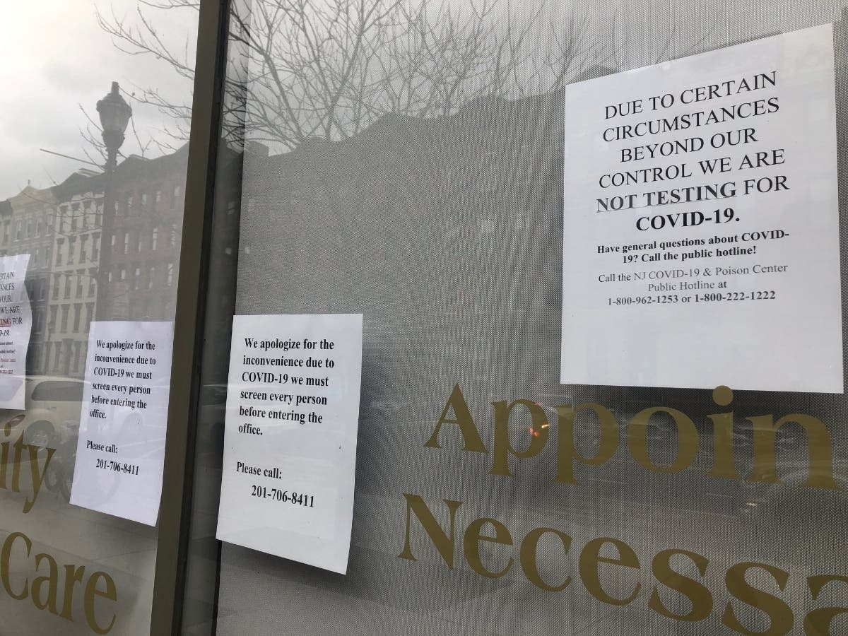 Signs at an urgent care facility in Hoboken, NJ.