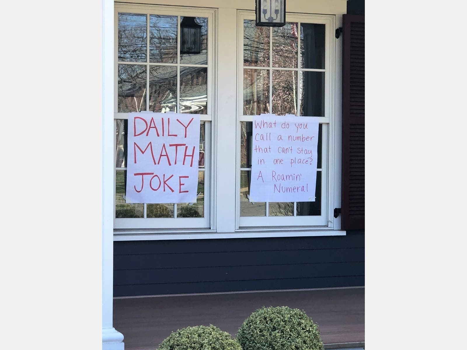 Westfield High School math teacher Callie Campbell posts a daily math joke and puzzle in the front windows of her Westfield home for passersby.
