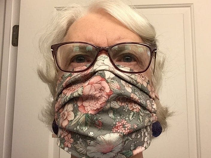Pam Gosner and her mask. Now the Summit volunteers are raising money for face shields.