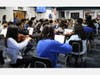 High school and intermediate school student musicians rehearse together during District Music Day on Jan. 8 as Westfield High School orchestra director Craig Stanton conducts.