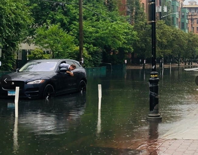 A man's car stalls in North Jersey during Tropical Storm Fay, July 2020.