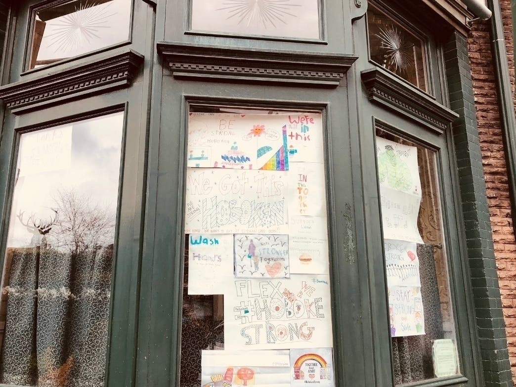 "We continue to see a substantial rise of cases in Hoboken," said the mayor, citing travel, indoor gatherings, and more. Pictured: A restaurant window in Hoboken.