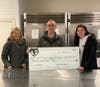 Ally Lipschitz (right) presenting the Summit nonprofit SHIP with a check for $1,011.21. Pictured with her are Craig Gangi and Becky Shamim of SHIP.