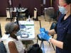 Lela Ingram, 65, a resident of Woodbridge and a parishioner of Wallace Chapel in Summit, got the 25,000 coronavirus vaccine dose at the Summit Community Center last month.