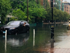 A man looks out of his stalled car in a low-lying area in Hoboken during a storm last July. Low-lying and coastal areas of North Jersey, like the Hudson County waterfront (pictured), are under a coastal advisory.