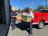 Deputy Coordinator Craig Dufford and Coordinator Christopher Mullin unloading the supply of masks received from the County OEM.