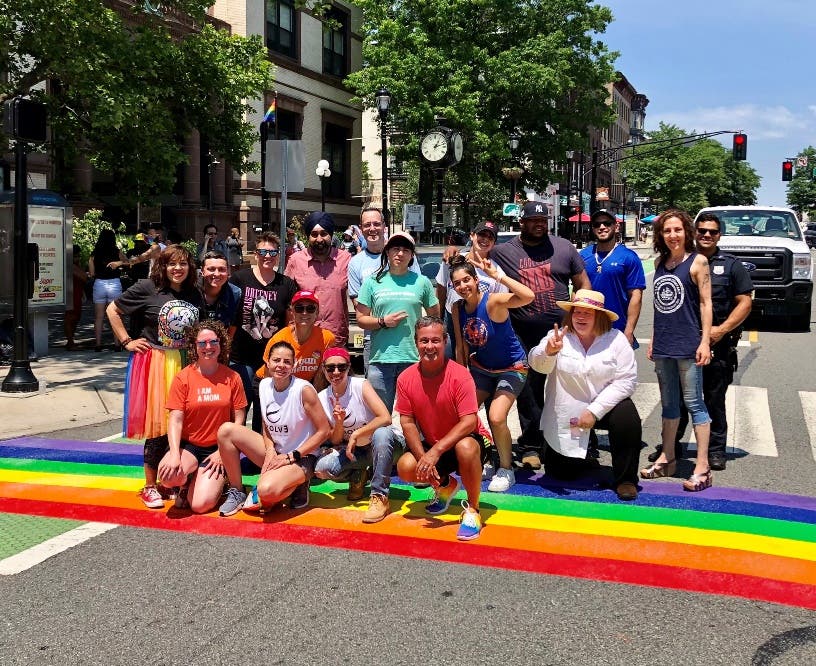 Mayor Ravi Bhalla, Hudson Pride Center, elected officials and residents after painting the Pride crosswalks near City Hall earlier this year in celebration of Pride Month.