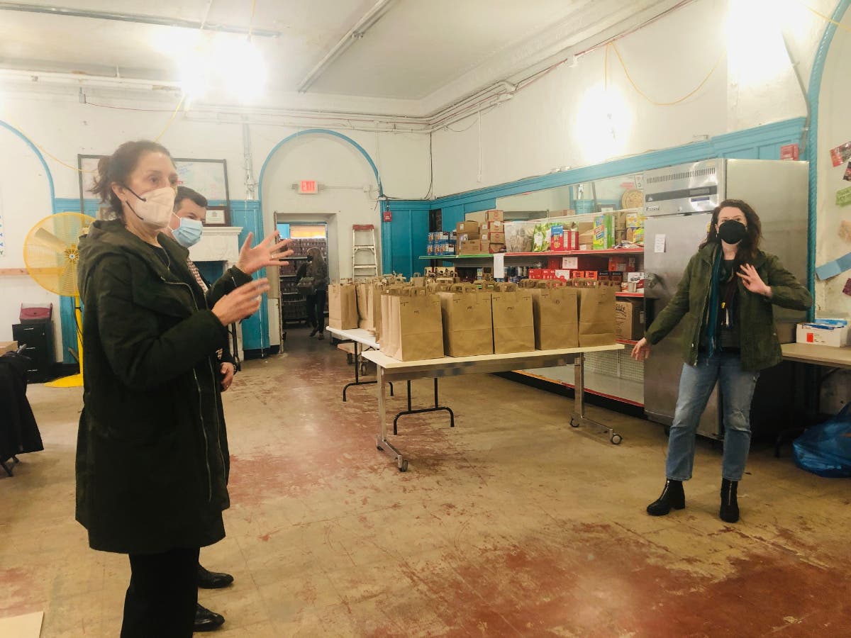 Hoboken Community Center staff talk about the food pantry for needy residents.