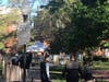 Investigators arrived on a scene in front of a bench in Church Square Park on Monday morning and began setting up a tent and police tape.