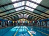 The six-lane Pershing Pool in Jersey City, open to city residents and non-residents alike, now has a retractable roof.