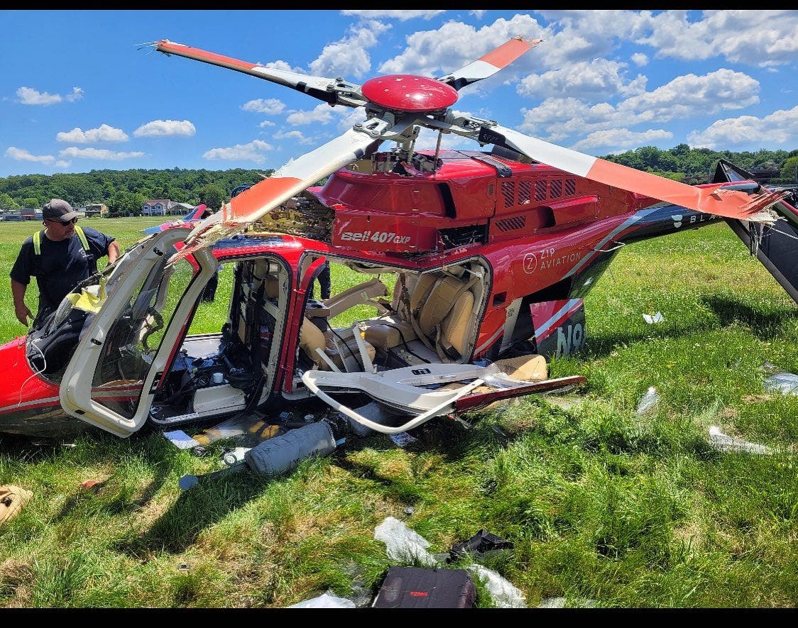 Police officers who responded to Essex County Airport found the pilot leaning out of the cockpit with a head wound, police said.