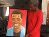 Hawa Fofana with a painting of her son.
