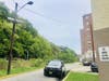 A police car sits on the block Sunday morning where Christopher Garcia, 28, was shot to death in Hoboken. The street is alongside the Hudson-Bergen Light Rail tracks.