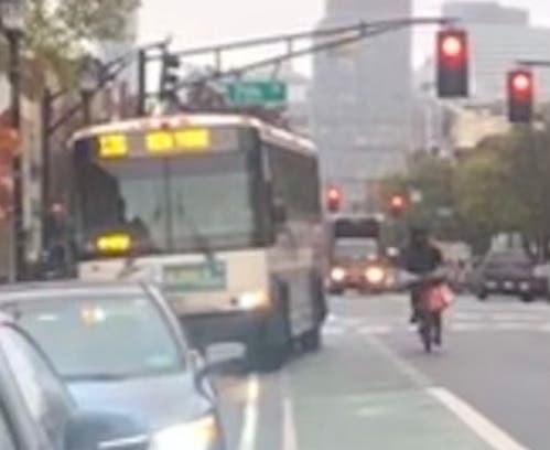 Buses and parked cars need to cross over the bike lanes (seen in green above) on Washington Street in Hoboken.