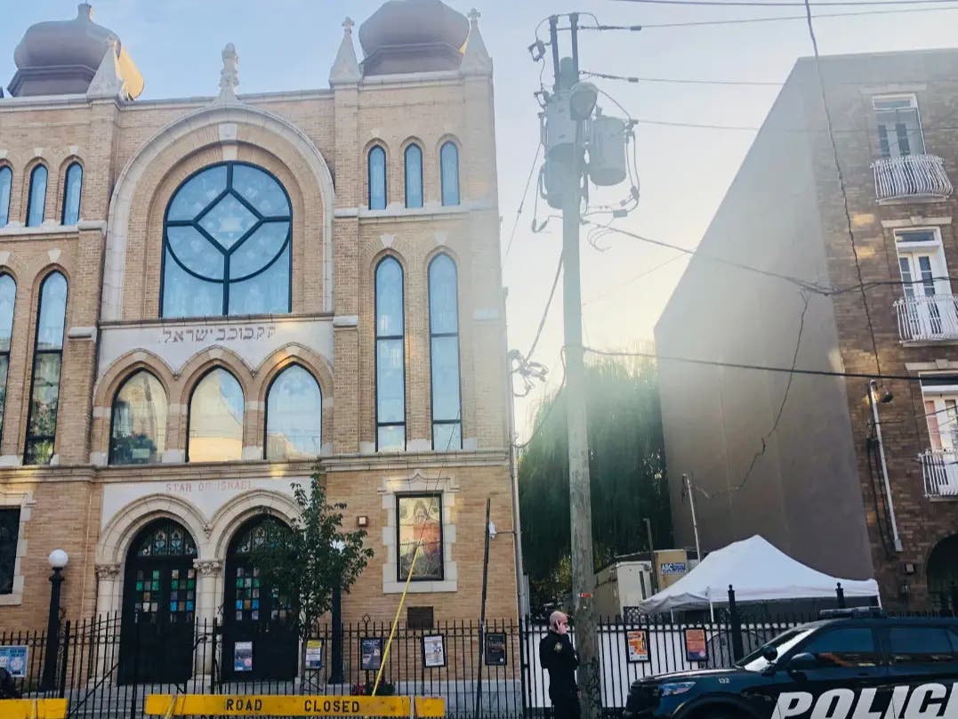 A Jewish Federation serving Essex and Union counties is hosting a virtual program on what local leaders are doing to combat antisemitism. Pictured: Police protect a North Jersey synagogue last month.