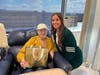 Sammy with cancer patient Barbara D'Agosta in the infusion center at the John Theurer Cancer Center.