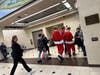 Santas strutting through Secaucus station.