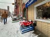 A snowy parking spot on 4th Street.