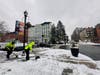 City workers clear the sidewalks near an intersection in Hoboken, Tuesday morning, Jan. 16, 2024.