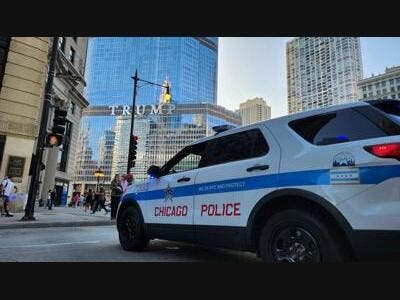 A Chicago police car is parked in front of Trump Tower in downtown Chicago. 