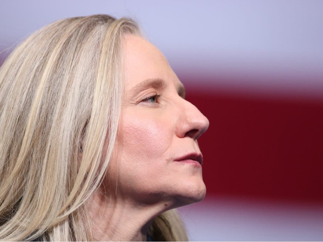Virginia Gov. Abigail Spanberger listens as former President Barack Obama speaks at a Nov. 2025 rally as the Democratic nominee.
