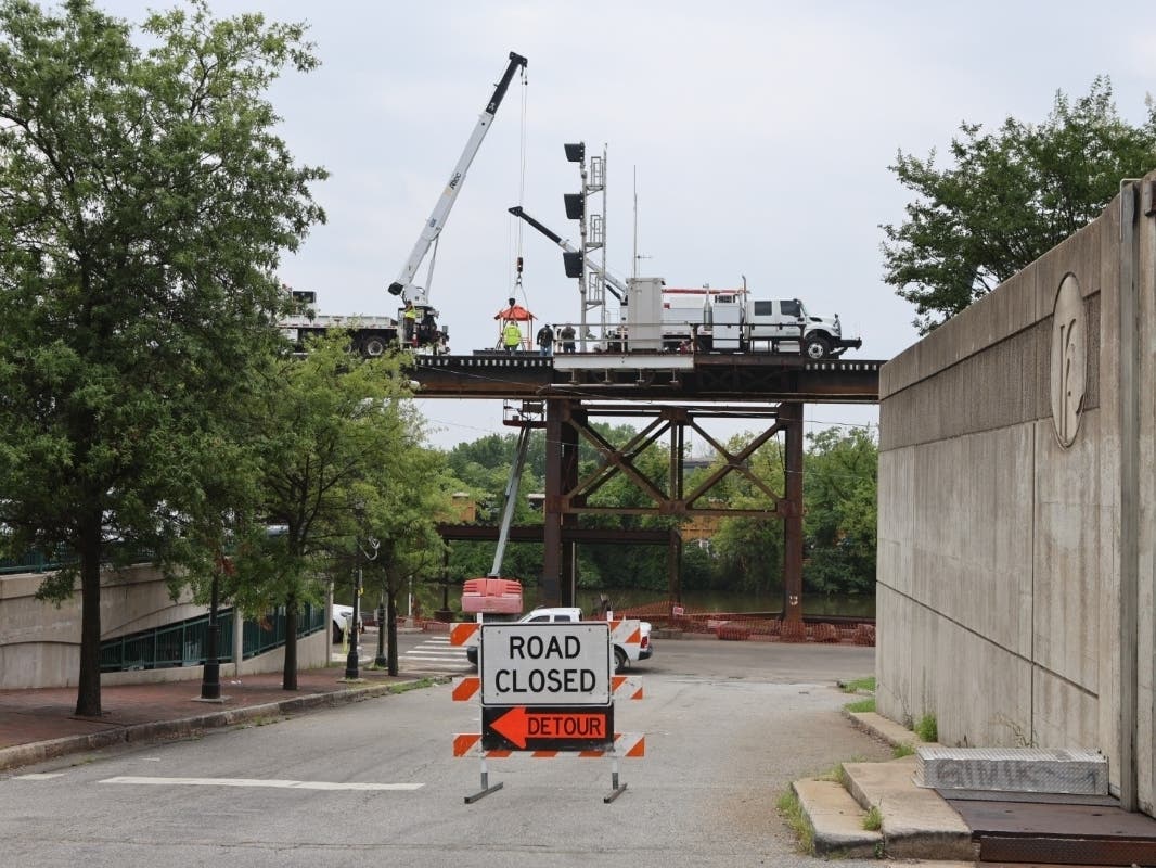 CSX Transportation is working to repair the damage near the intersection of Dock and 20th Streets in Richmond that contributed to three train cars derailing from a 200-car train and crashing into the Riverfront Canal on July 3, 2026. 