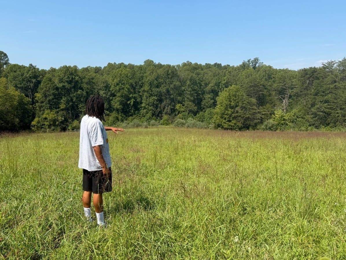 Michael Carter Jr. stands on his family’s 116-year-old farmland in Orange County, Va. One of the proposed routes of the Valley Link transmission line will encroach on the property, Carter says.