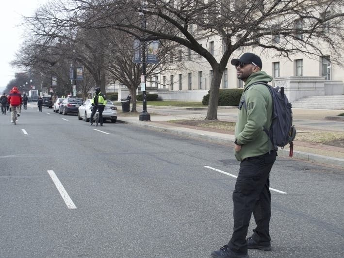 Former national Proud Boys leader Enrique Tarrio looked on as far-right activists celebrating the Jan. 6 Capitol attack marched down Constitution Avenue on Tuesday, Jan. 6, 2026.