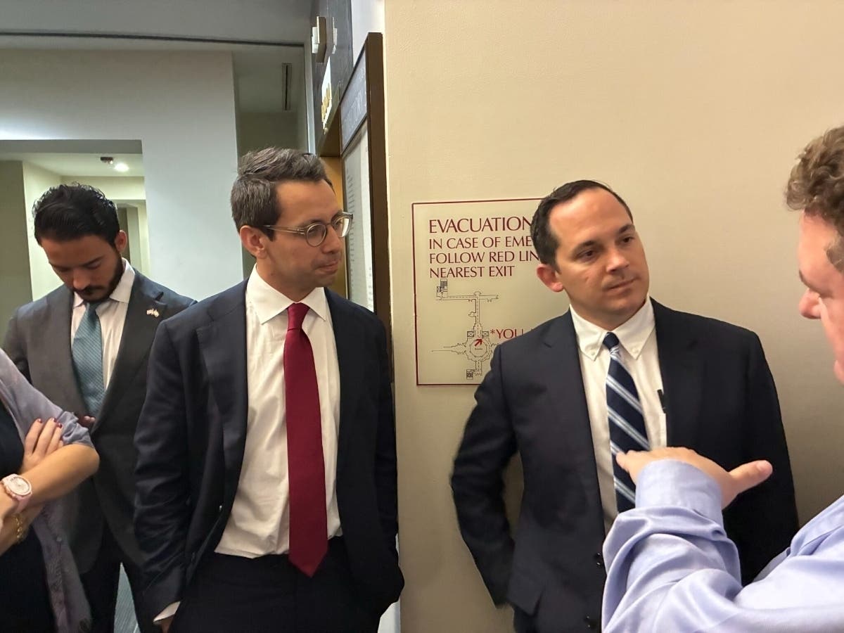 James Fishback and Anthony Sabatini talk to reporters after their July 21, 2026, court hearing. 