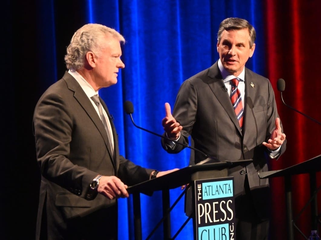 Congressman Mike Collins (left) and Derek Dooley debate each other Sunday as part of the Atlanta Press Club Loudermilk-Young Debate Series. 