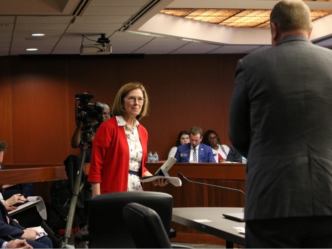 State Election Board member Janice Johnston, pictured here at a Senate Ethics Committee meeting in March, announced her resignation from the board Thursday.