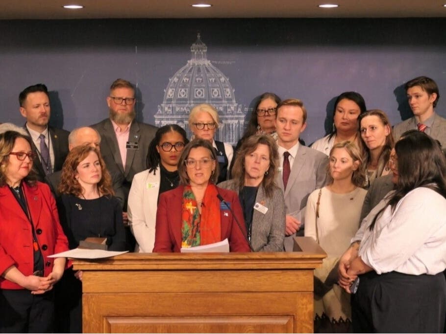 Montana state Sen. Cora Neuman, a Democrat, speaks at a January news conference in the Minnesota Capitol surrounded by state lawmakers from across the country.