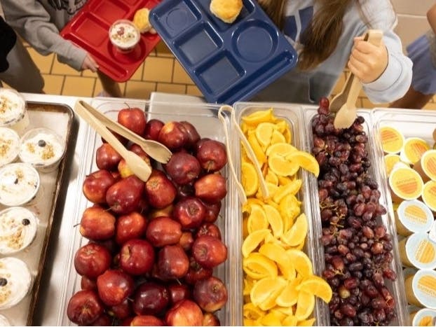 Elementary school kids go through the lunch line. Cuts to the nation’s largest food assistance program may cause students to lose access to free breakfast and lunch. 