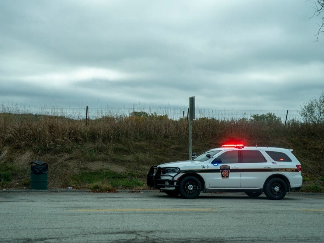 A state trooper makes a traffic stop along the Pennsylvania Turnpike between Pittsburgh and Harrisburg on October 14, 2025. 