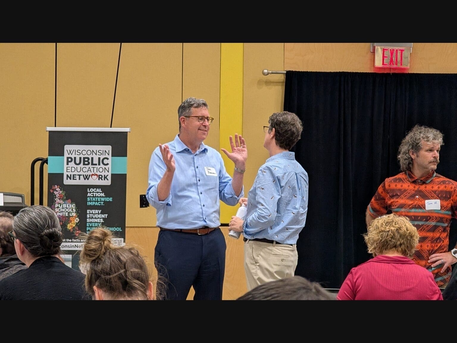 Former DOA Secretary Joel Brennan, who is running in the Democratic primary for governor, speaks with State Superintendent Jill Underly at the Wisconsin Public Education Network summit in Superior. 