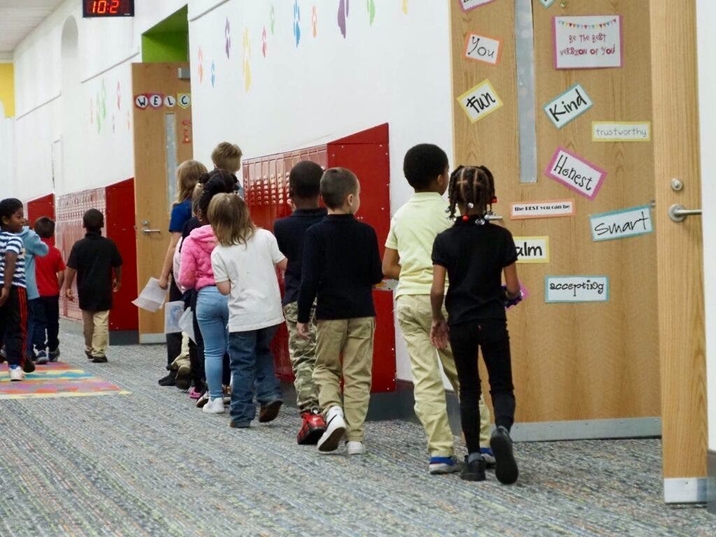 Students walk down the hall at a public elementary school. The Trump administration has given states more flexibility in spending some federal dollars.
